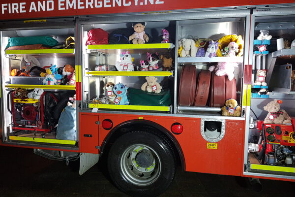 Toys investigating the fire engine.