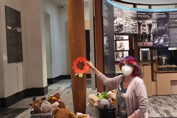 Anne and the soft toy sleepover toys laying our wreath at Pou hi Te Whatu-ā-mahara, Auckland War Memorial Museum.